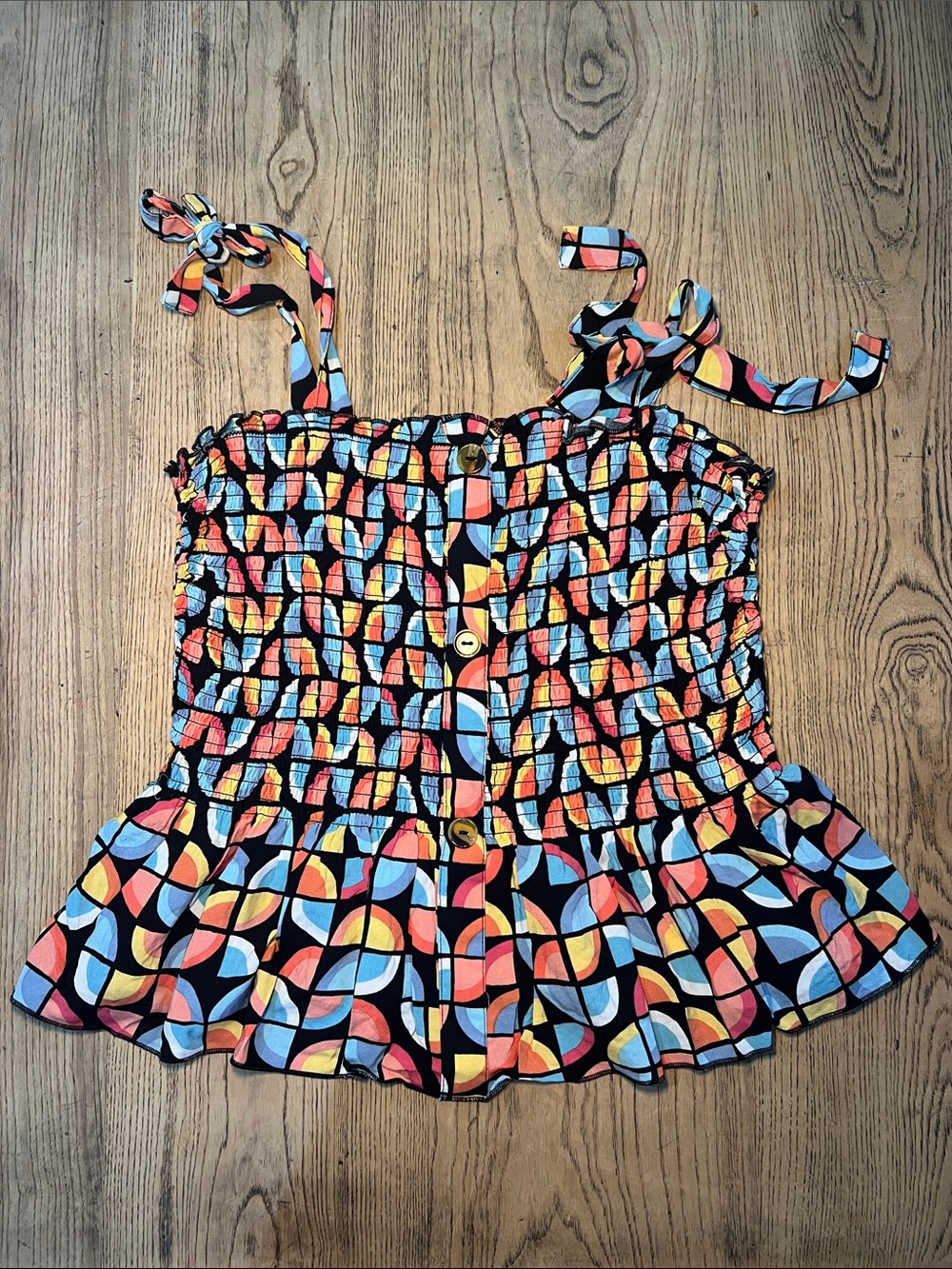 Peplum light weight colorful tie shoulder top. Large